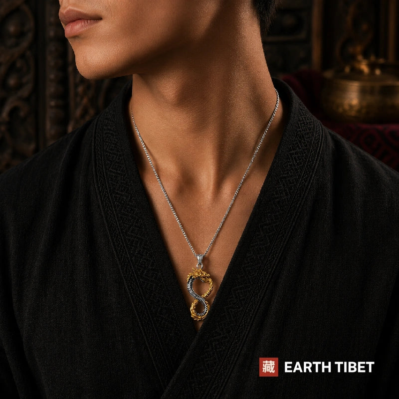 Man wearing the ouroboros dragon necklace over a black jacket, the figure eight visible at the chest