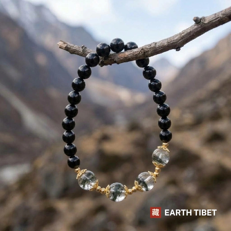Black obsidian beads running round the back of the phantom quartz bracelet