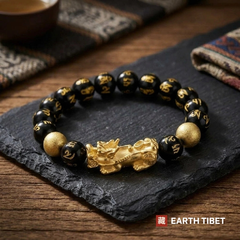 Black mantra bead bracelet with a gold-toned pixiu charm