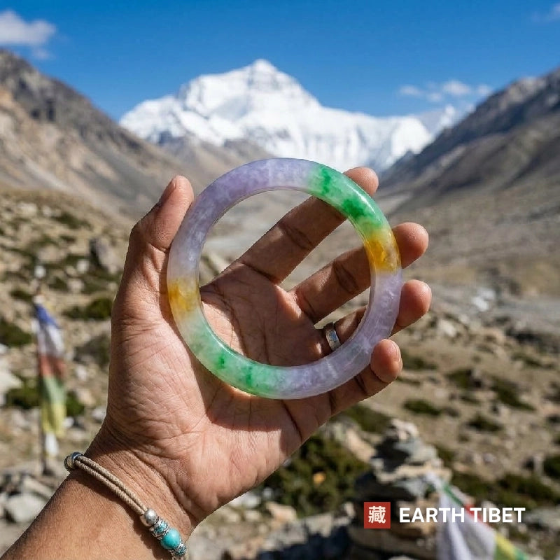 Tricolour bangle held up in front of a snow-capped Himalayan peak