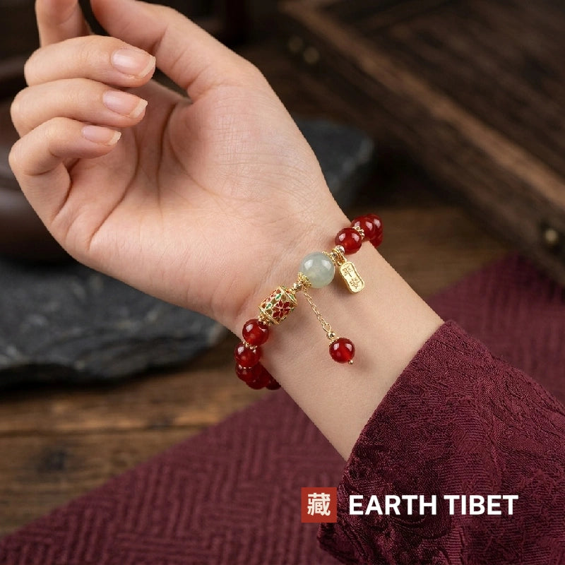 Red agate peace bracelet worn on a wrist with the ping an tag facing out