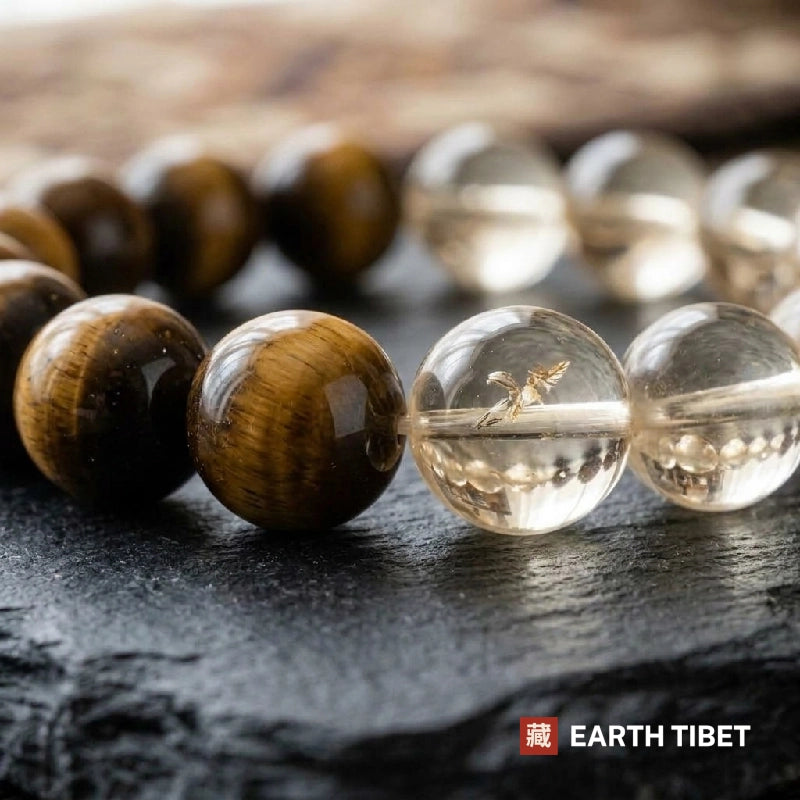Macro of the pale citrine beads showing internal veiling beside the tiger eye