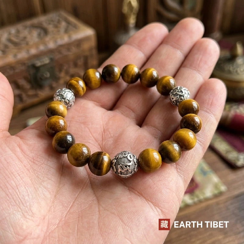 Tiger eye mantra bracelet resting in an open hand