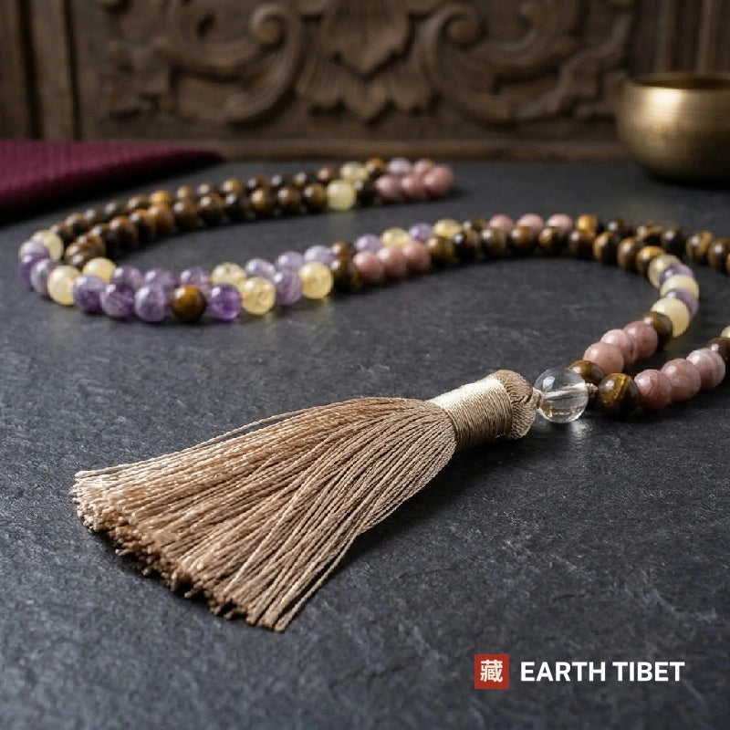 Silk tassel and clear quartz guru bead at the end of the mala