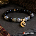 Labradorite and black tourmaline bracelet with a gold om charm