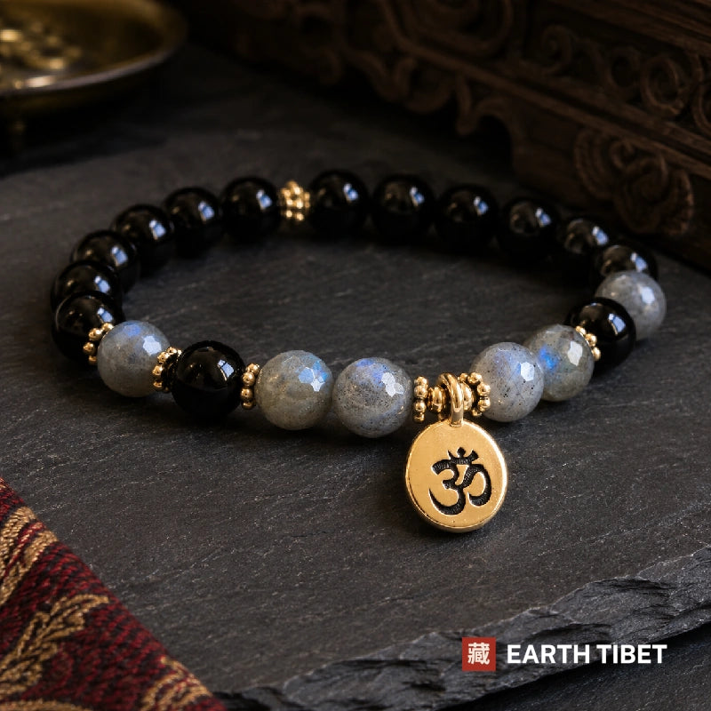 Labradorite and black tourmaline bracelet with a gold om charm