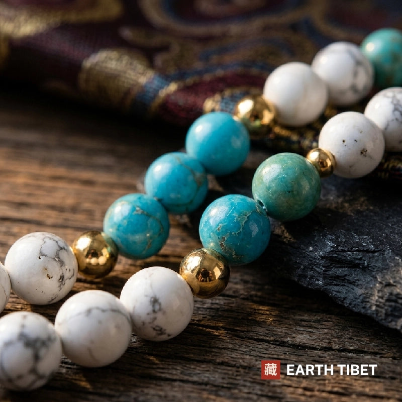 Close view of turquoise and white howlite beads with small gold spacers
