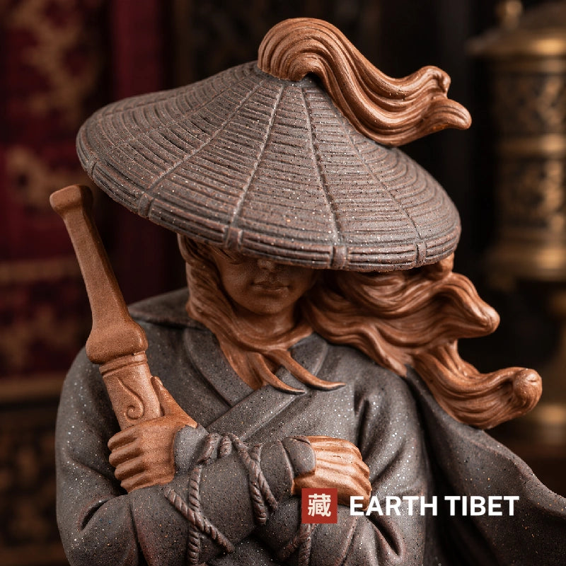 Close view of the bamboo hat tilted down over the face with hair streaming behind