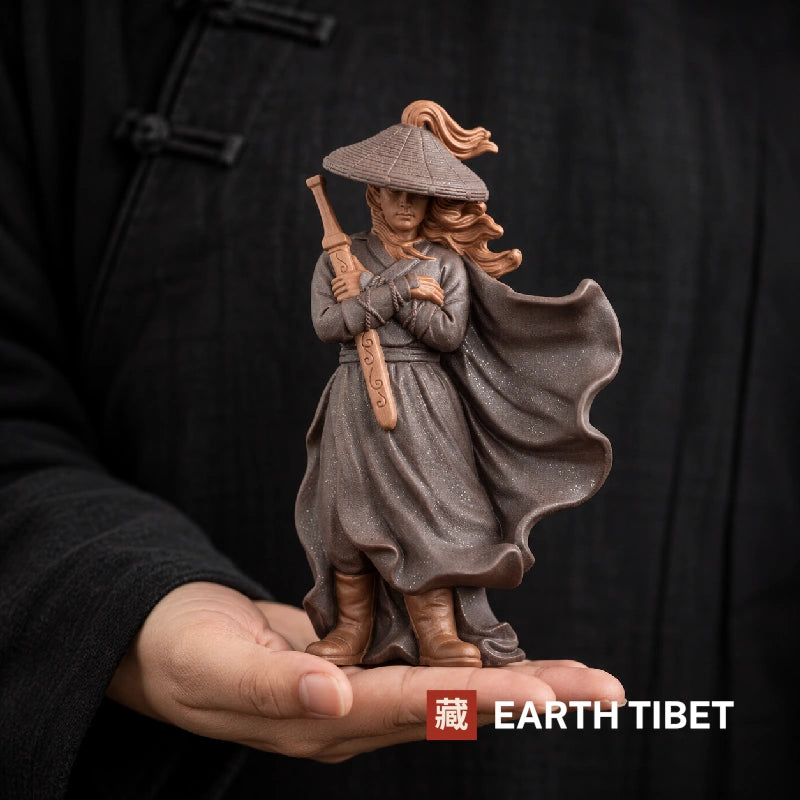The wandering swordsman statue held in one hand for scale