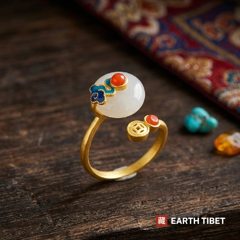 Adjustable gold-toned ring with a white chalcedony dome, enamel cloud and a small coin