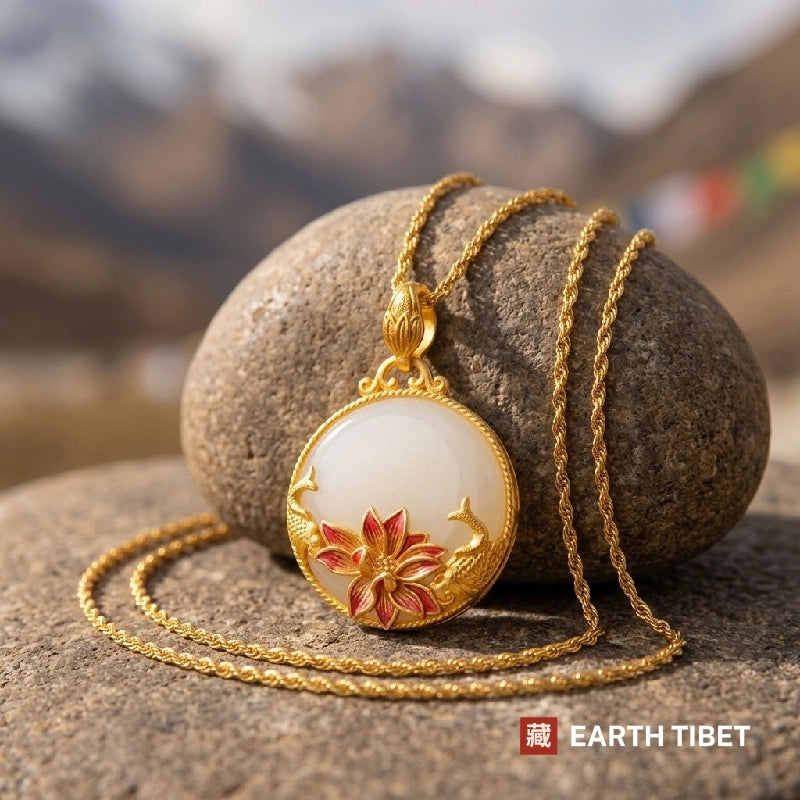 Koi lotus pendant resting against a stone with mountains and prayer flags behind