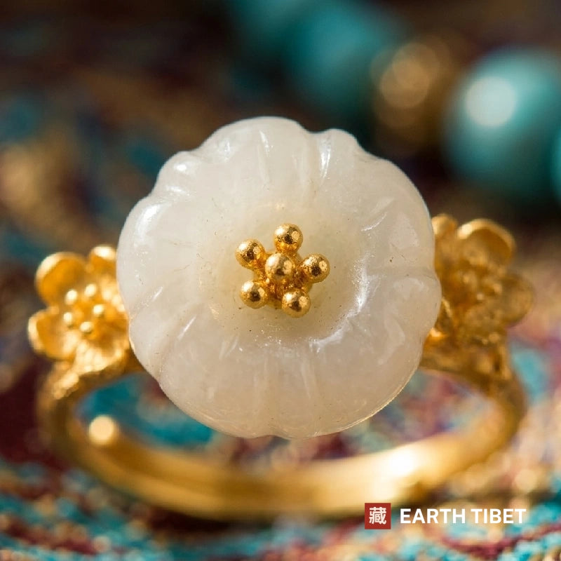 Close view of the five carved petals and the gold stamens at the centre